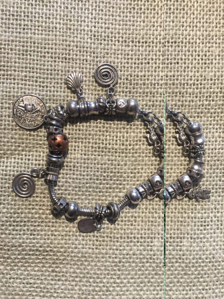 Bracelet 429, a layered silver-tone charm bracelet